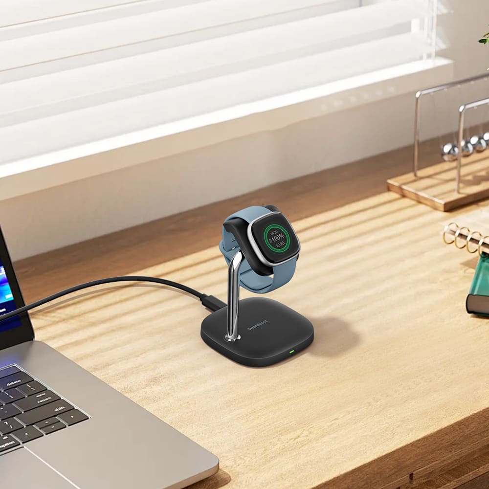 Fitbit smartwatch charging stand beside a computer for convenient desk charging SwanScout 505FB